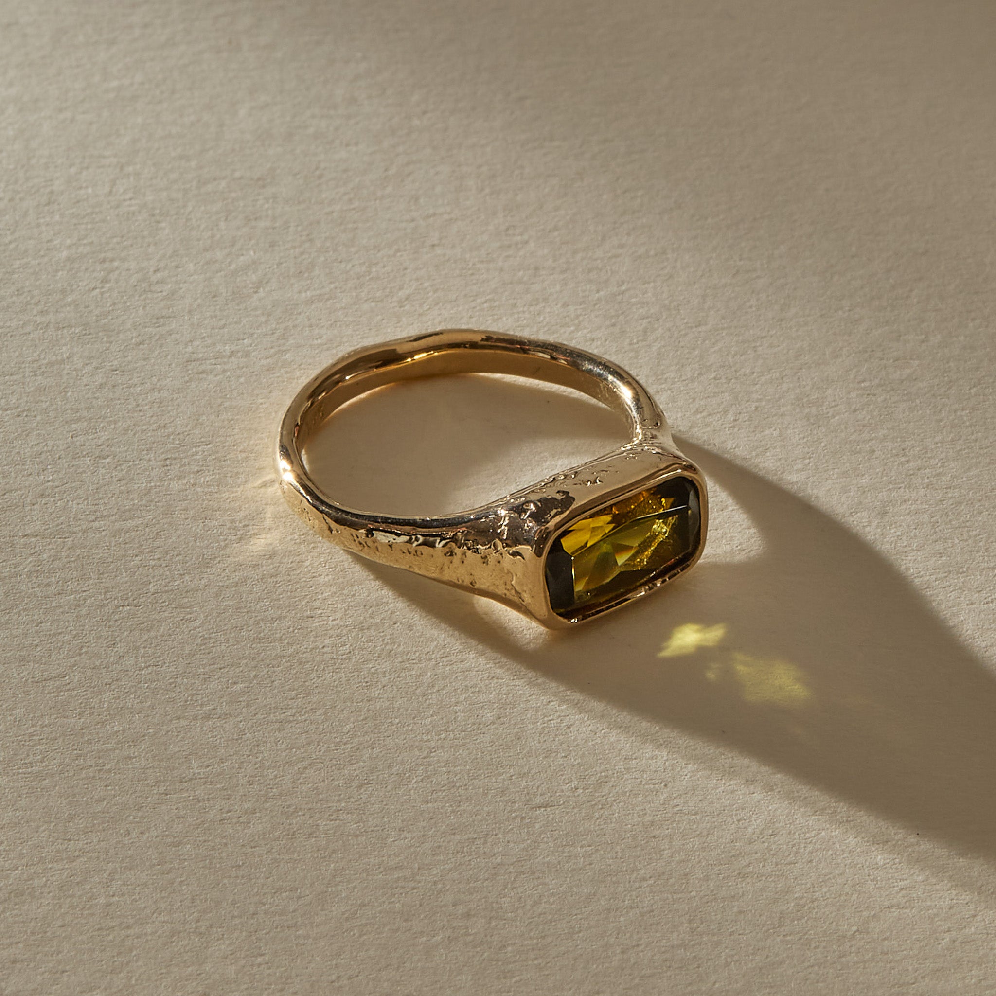 Green Tourmaline Signet Ring II in solid recycled 14k gold, a rectangular faceted green tourmaline in a textured hand-carved band.