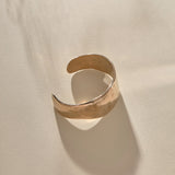 Guardian Hammered Cuff in bronze from above, showing the cuff opening.