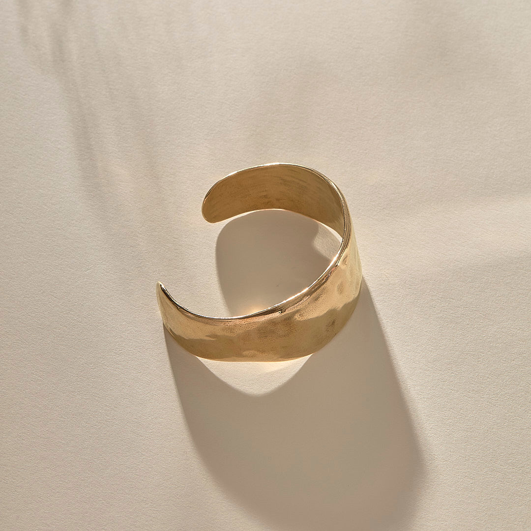 Guardian Hammered Cuff in gold from above, showing the cuff opening.