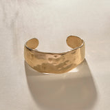 Guardian Hammered Cuff Bracelet in solid recycled gold, a wide, hand-carved cuff with a hammered texture.