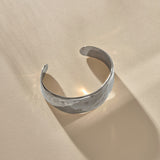 Guardian Hammered Cuff in sterling silver at an angle, showing the open back and textured surface.