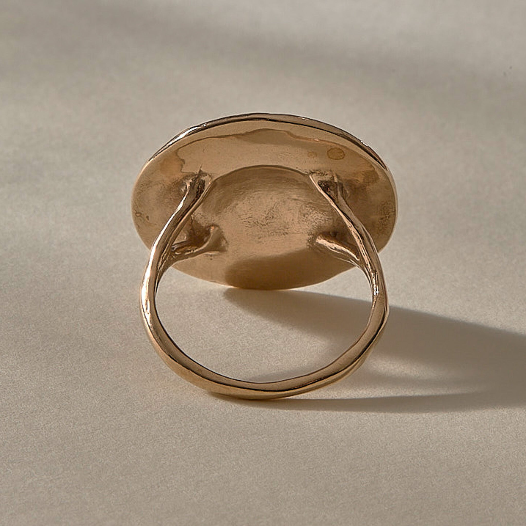 Heart of the Sun Statement Ring in recycled bronze from the back, showing the smooth underside.