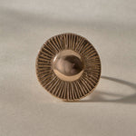 Heart of the Sun Statement Ring in recycled bronze from the front, showing the round sunburst face.