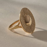 Heart of the Sun Statement Ring in solid recycled gold from the side, showing the sunburst face and slim band.