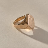 Heritage Textured Signet Ring in recycled bronze at an angle, showing the dappled signet face.