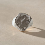 Heritage Textured Signet Ring in recycled sterling silver from the front, a softly indented, dappled oval face.