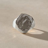 Heritage Textured Signet Ring in recycled sterling silver from the front, a softly indented, dappled oval face.