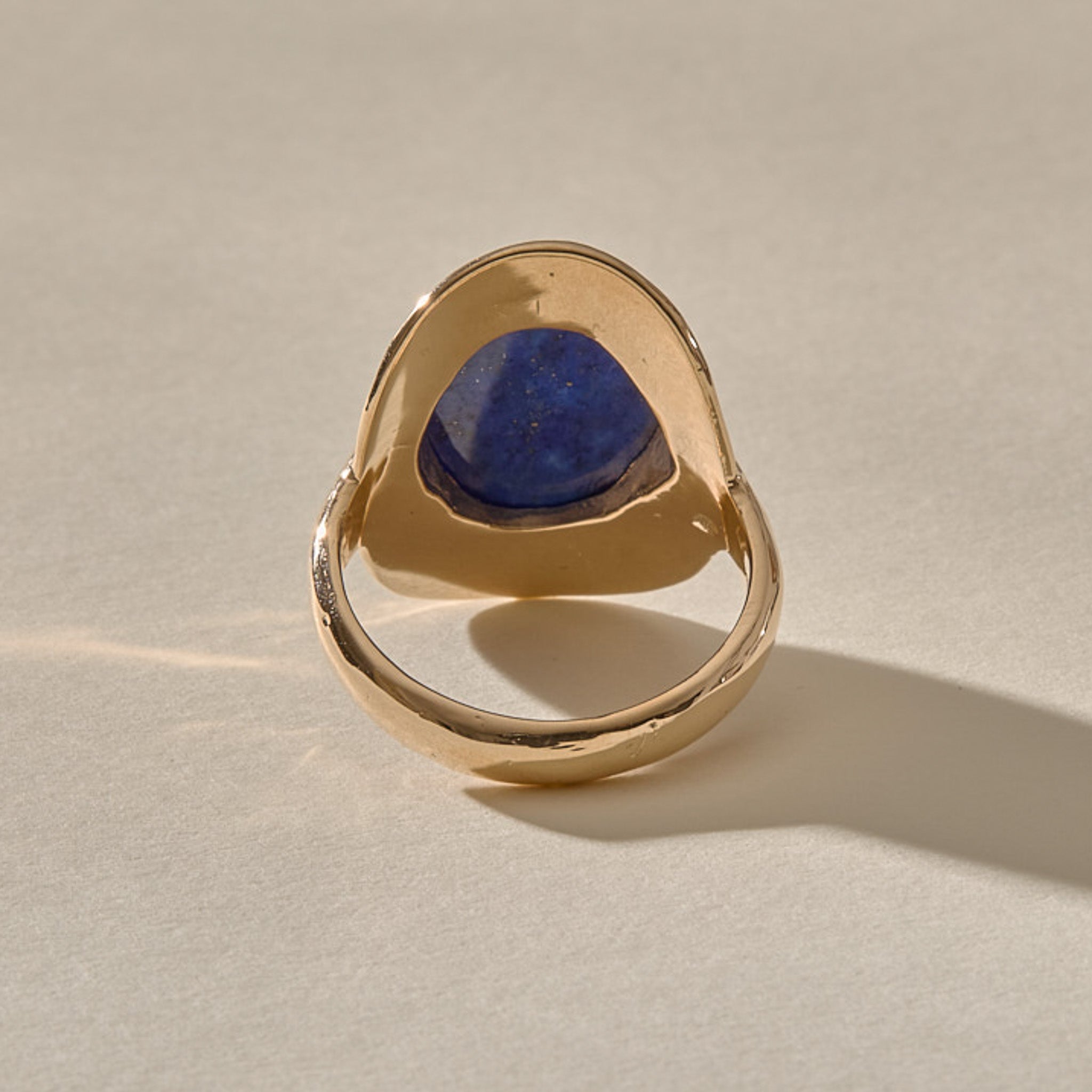 Back of the Inanna Lapis Shield Ring, showing the open back that lets the lapis touch the skin.