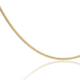 Close up of the gold Jera Snake Chain Anklet showing its polished snake chain texture.
