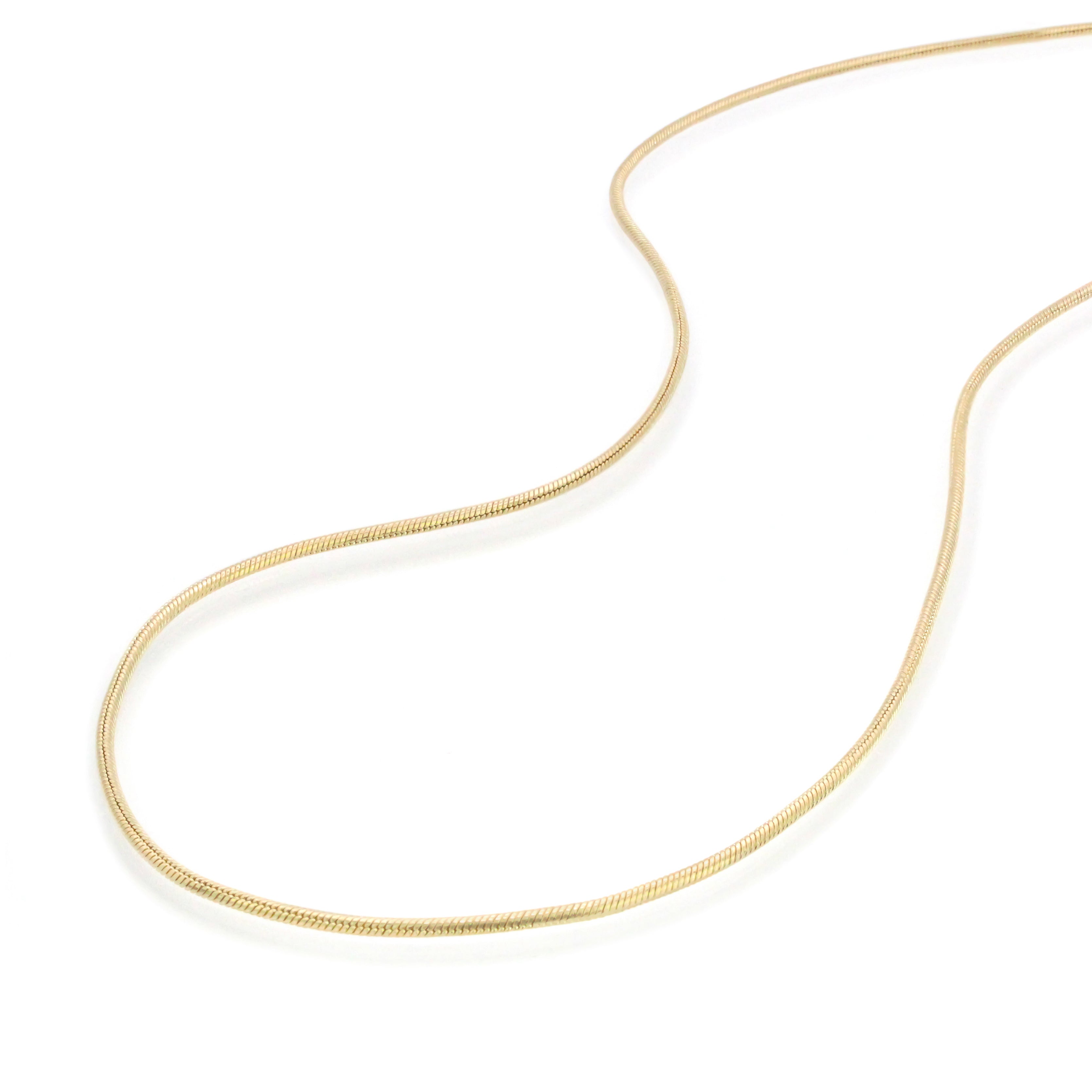 Gold Jera Snake Chain Anklet on a white background, showing its smooth, sleek shape.