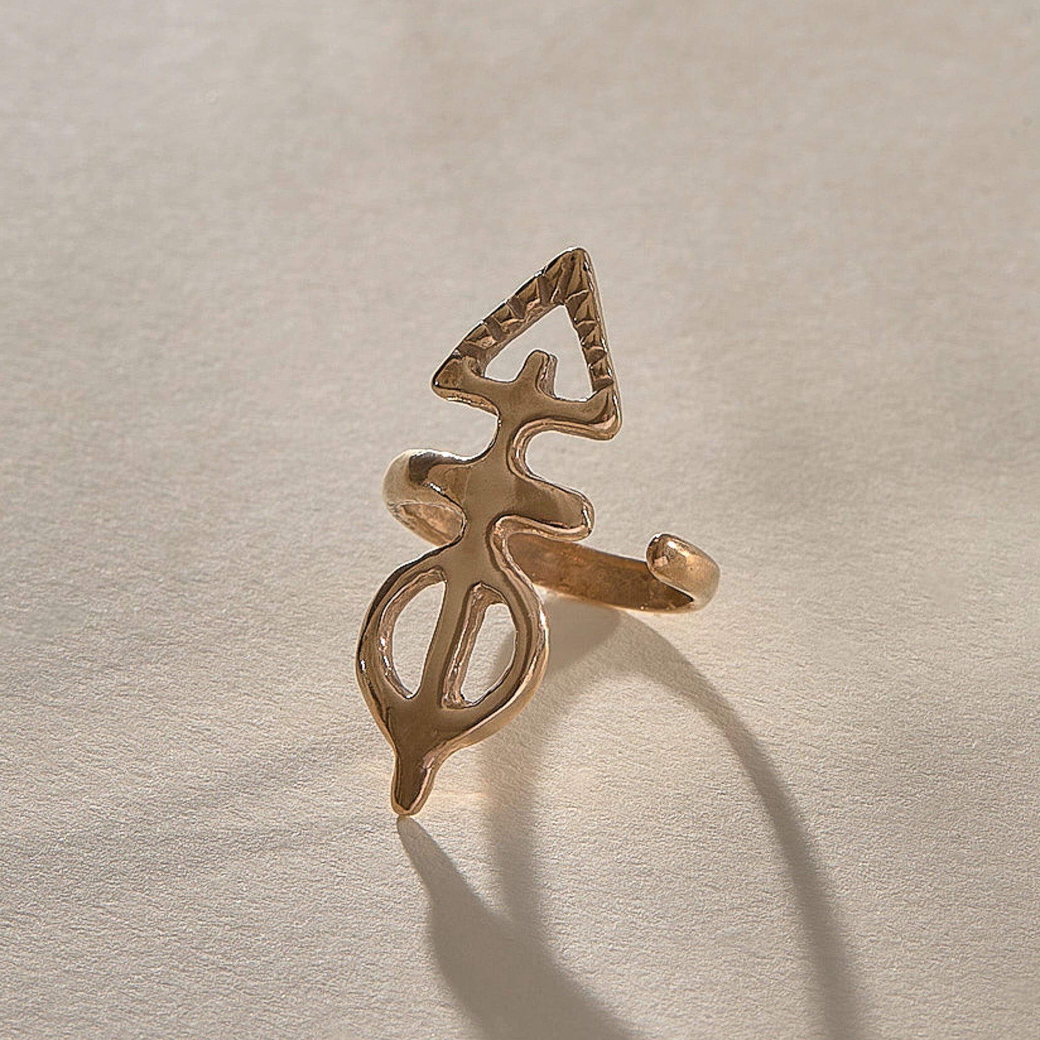 Ma'at Elemental Ring in recycled bronze, angled view of the sculptural adjustable band