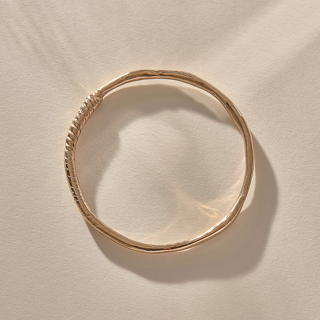 Rustic Magi Bangle in bronze from above, showing its organic round shape.