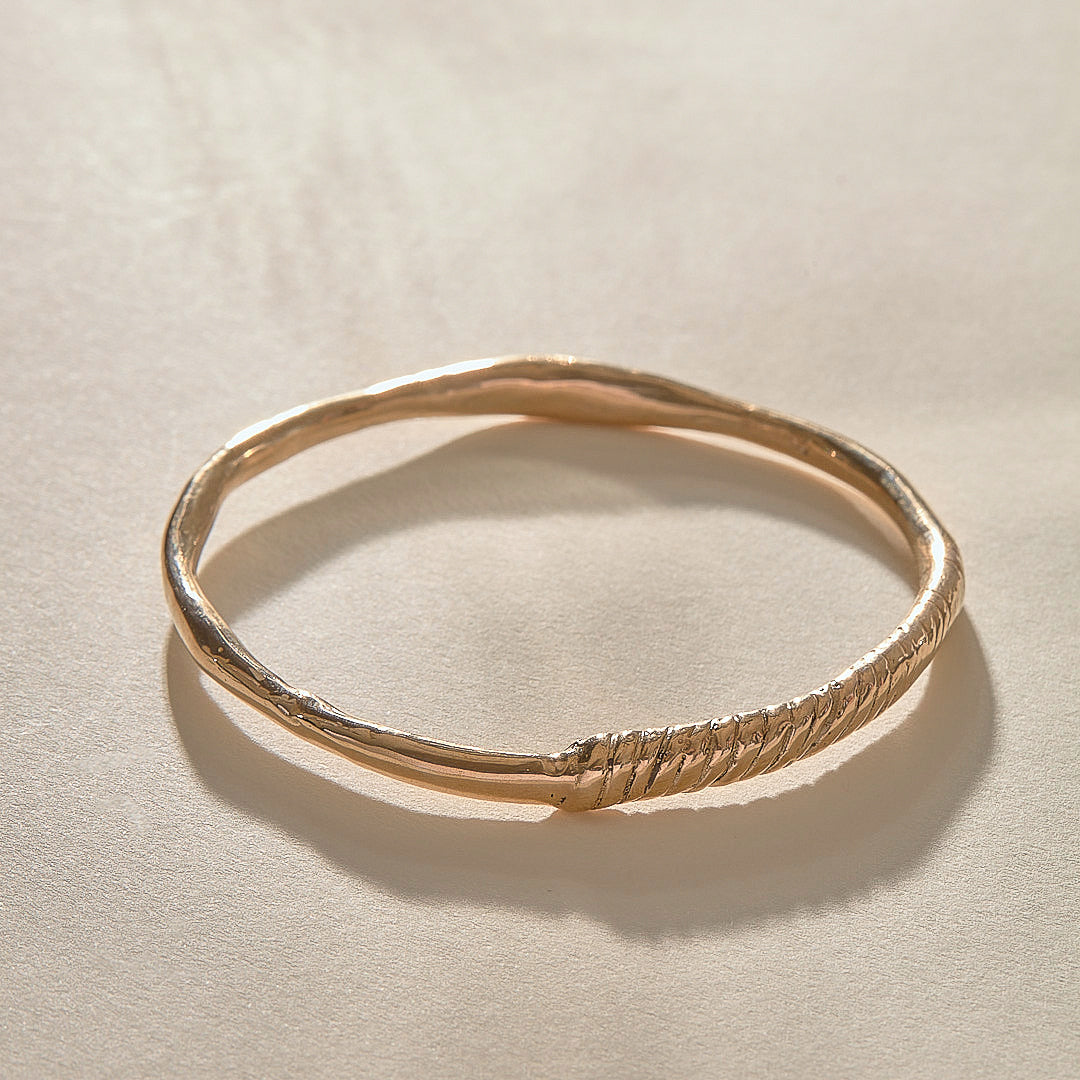 Rustic Magi Bangle Bracelet in recycled bronze, a hand-carved bangle with spiral detailing.