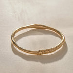 Rustic Magi Bangle Bracelet in solid recycled gold, a hand-carved bangle with spiral detailing.
