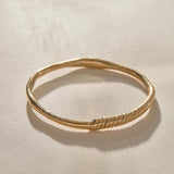 Rustic Magi Bangle Bracelet in solid recycled gold, a hand-carved bangle with spiral detailing.