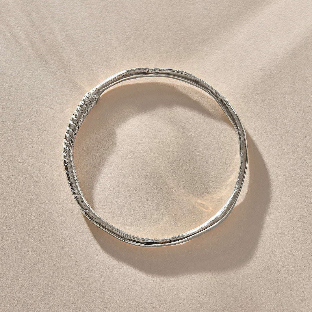 Rustic Magi Bangle in sterling silver from above, showing its organic round shape.