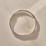 Rustic Magi Bangle in sterling silver from above, showing its organic round shape.