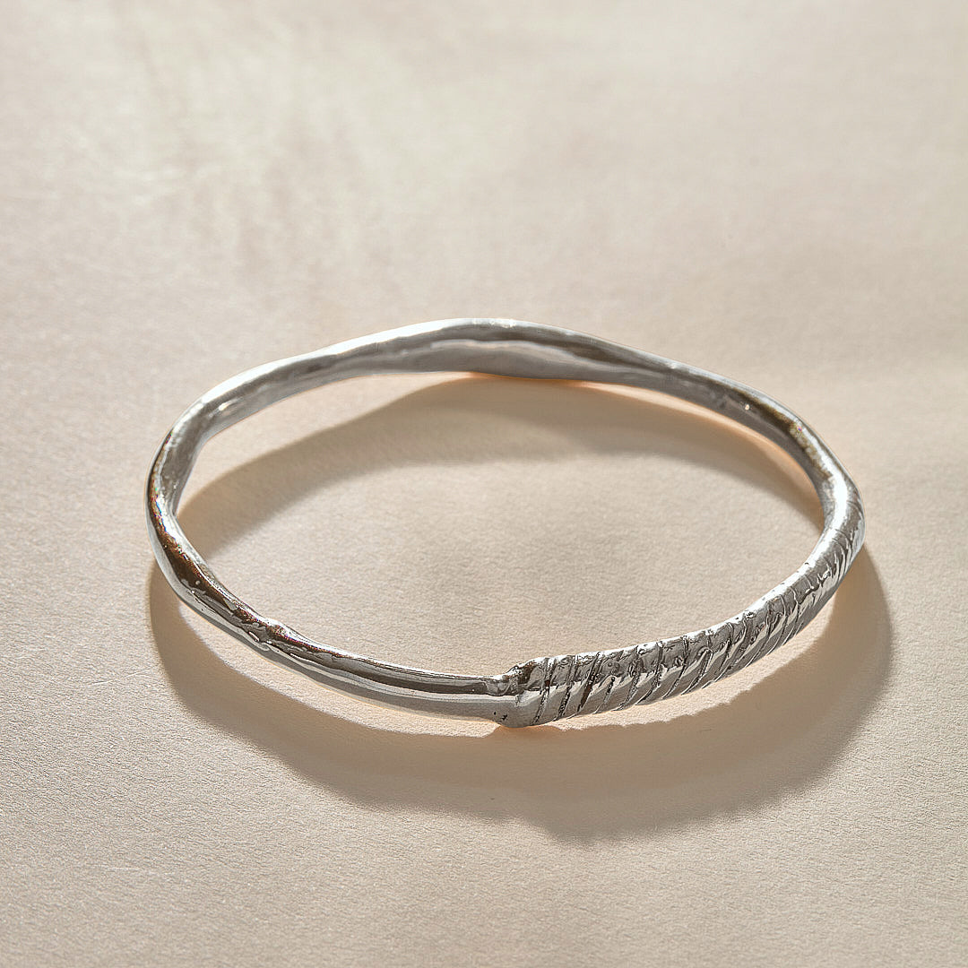 Rustic Magi Bangle Bracelet in recycled sterling silver, a hand-carved bangle with spiral detailing.