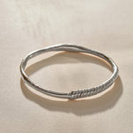 Rustic Magi Bangle Bracelet in recycled sterling silver, a hand-carved bangle with spiral detailing.
