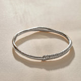 Rustic Magi Bangle Bracelet in recycled sterling silver, a hand-carved bangle with spiral detailing.