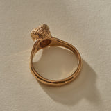 Maré Ring in recycled bronze standing upright, shell on top