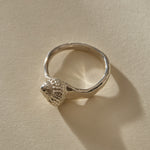 Maré Ring in recycled sterling silver, angled view of the textured shell