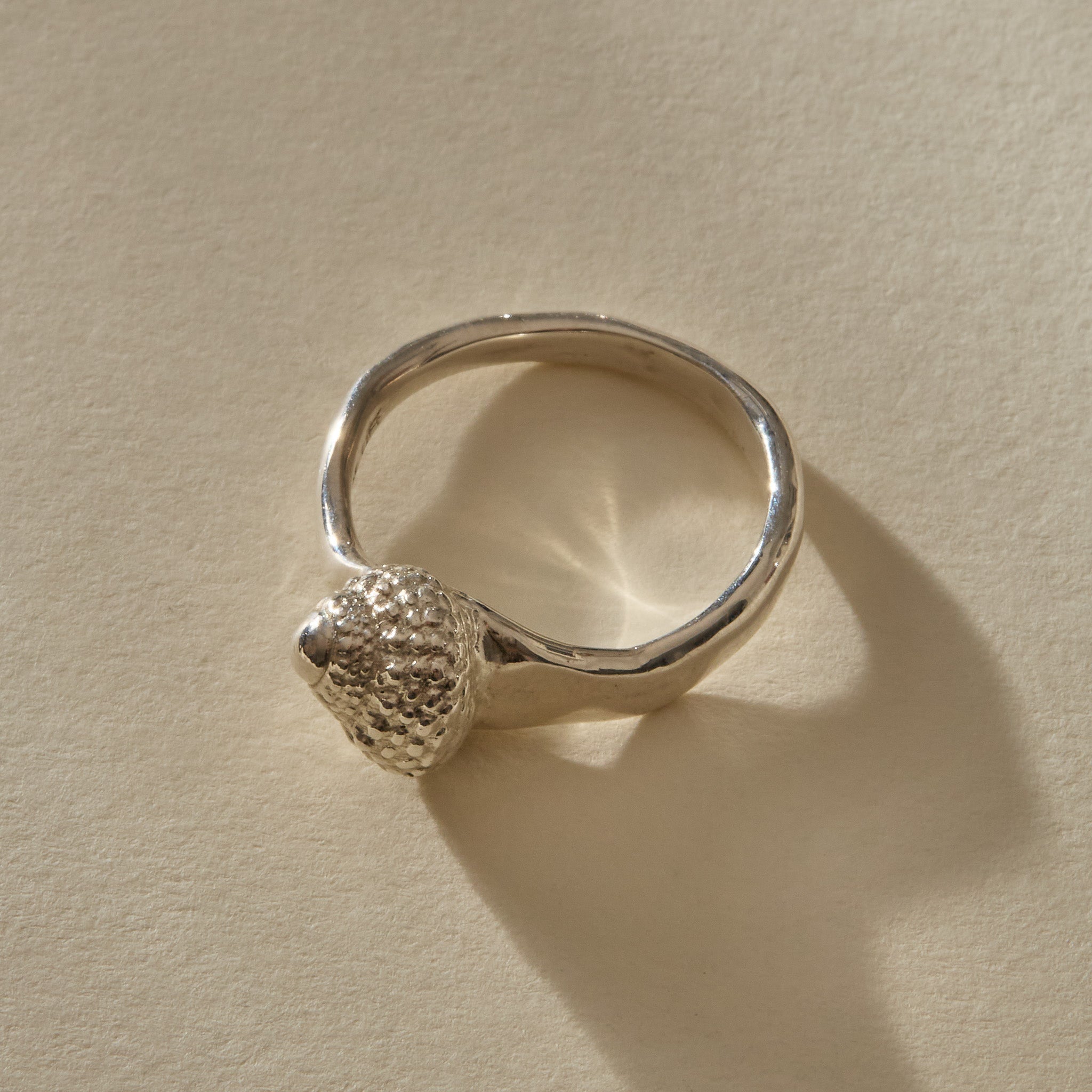 Maré Ring in recycled sterling silver, angled view of the textured shell