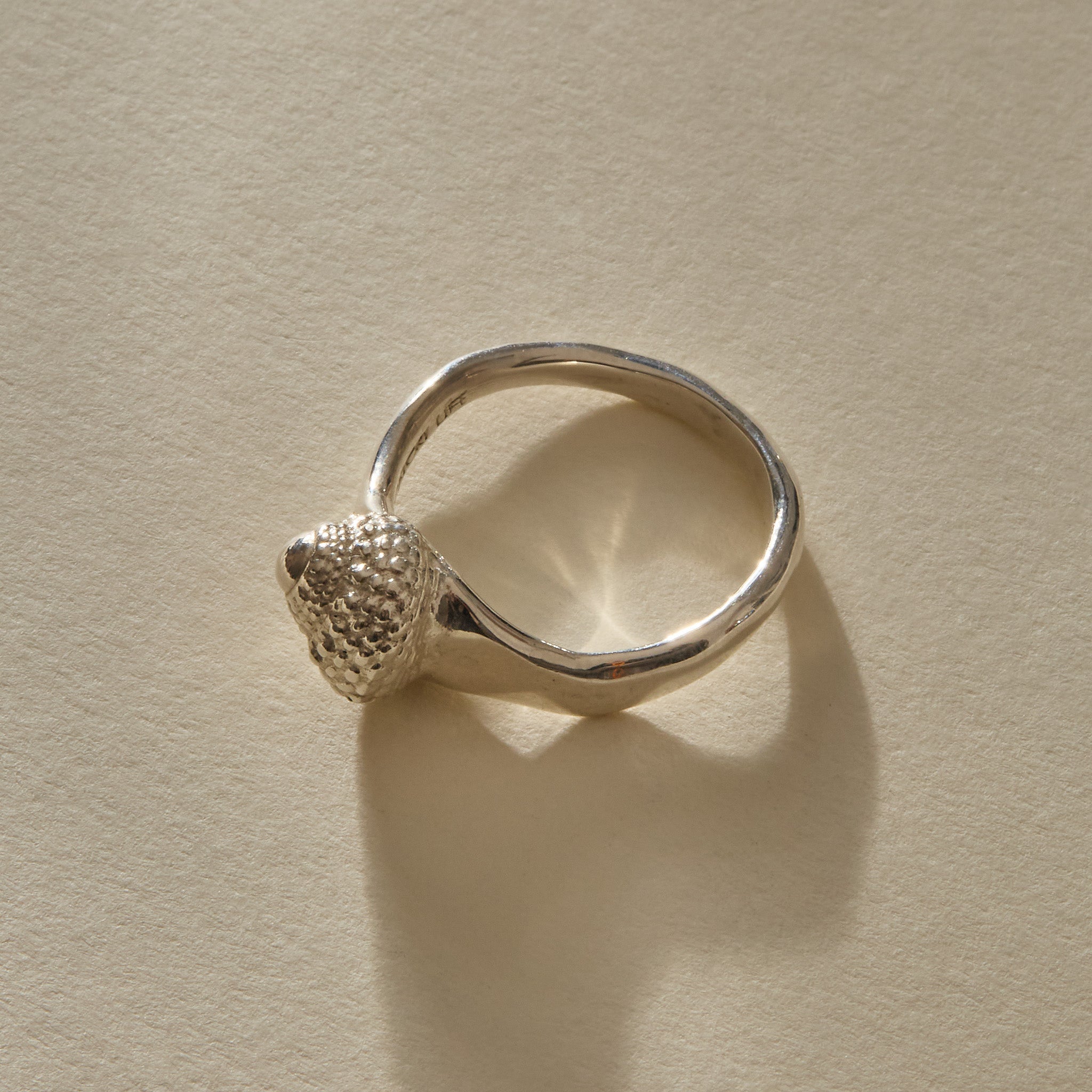 Maré Ring in recycled sterling silver, front view of the band cast from a real seashell