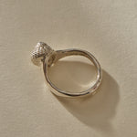 Maré Ring in recycled sterling silver standing upright, shell on top