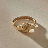 Maré Shell Ring in solid recycled gold, a hand-cast textured seashell on an organic band.
