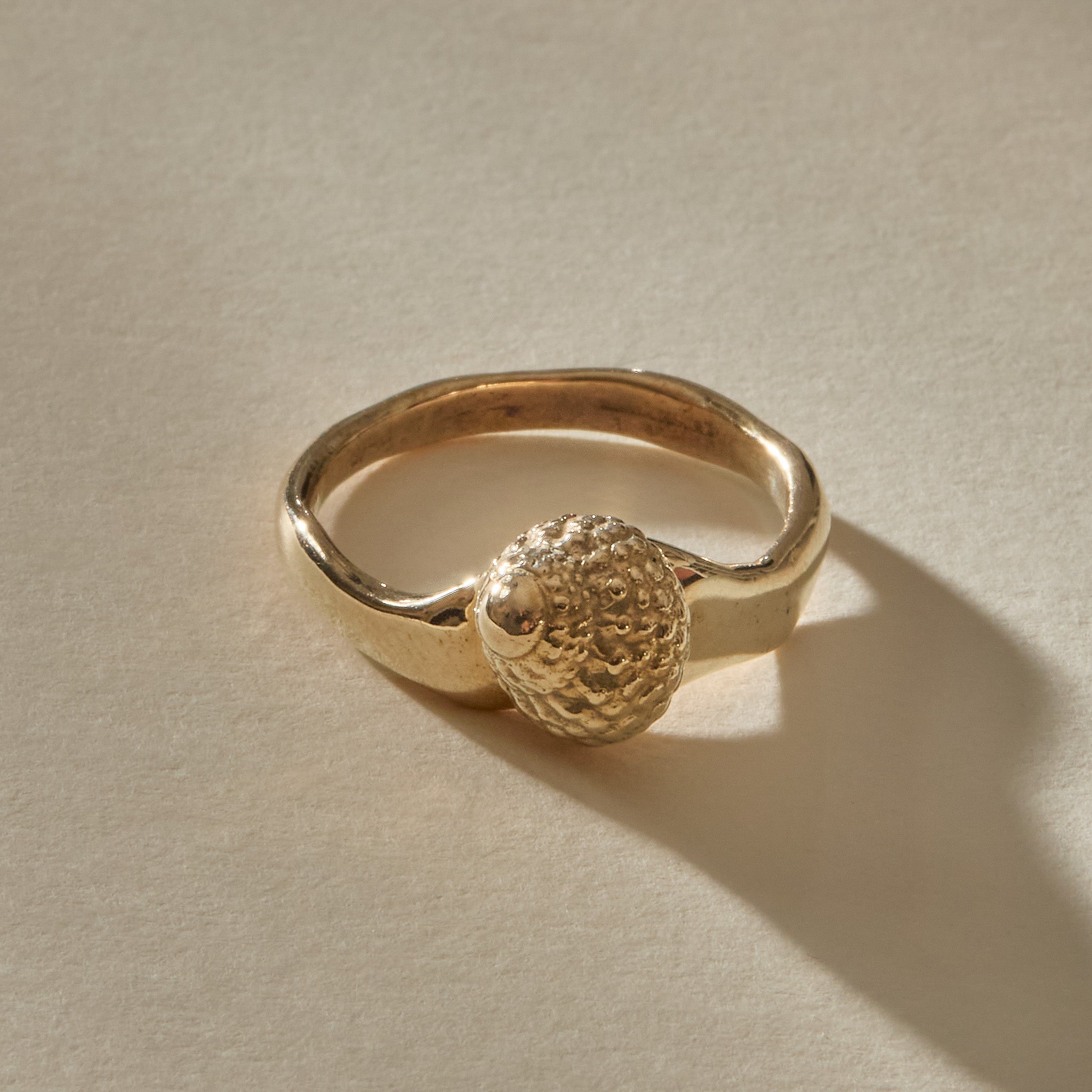 Maré Shell Ring in solid recycled gold, a hand-cast textured seashell on an organic band.