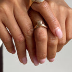 Maré Shell Ring on the hand, shown from a second angle.