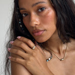 Maré Shell Ring in sterling silver worn by a model, styled for the sea.