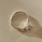 Maré Shell Ring in recycled sterling silver, a hand-cast textured seashell set to one side of an organic band.