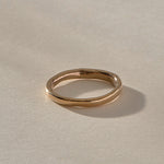 Mist Ring in recycled bronze, angled view of the softly rising and falling band