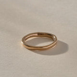 Mist Ring in recycled bronze, angled view of the softly rising and falling band
