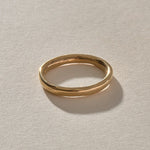 Mist Ring in solid recycled gold, front view of the softly rising and falling band