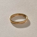 Mist Ring in solid recycled gold, front view of the softly rising and falling band