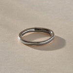 Mist Ring in recycled sterling silver, angled view of the softly rising and falling band