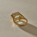Naïade Ring in 14k gold from behind at an angle, with the organic textured bezel rising around the aquamarine.
