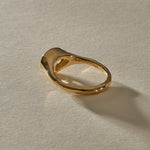 Back of the Oriente Ring, showing the soft gold bezel and smooth 14k gold band.