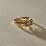 Oriente salt and pepper diamond ring from the front, showing the natural inclusions of the rose cut pear stone.