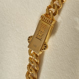 Oro Sagrado Cuban Link Bracelet in 14k gold, the box clasp and heavy curb links up close.