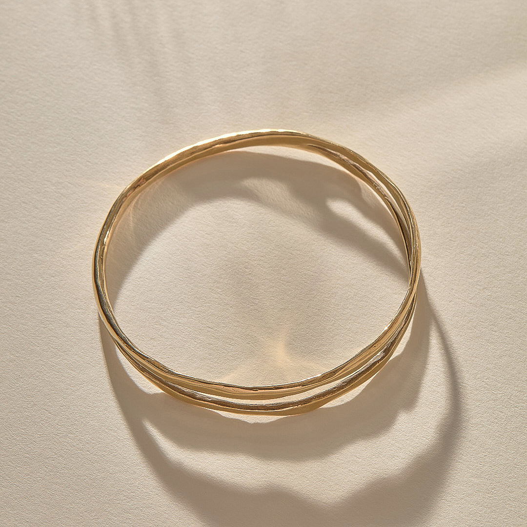 Reverie Organic Bangle Bracelet in solid recycled gold, a hand-carved bangle that splits down the center like a canyon.