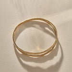 Reverie Organic Bangle Bracelet in solid recycled gold, a hand-carved bangle that splits down the center like a canyon.