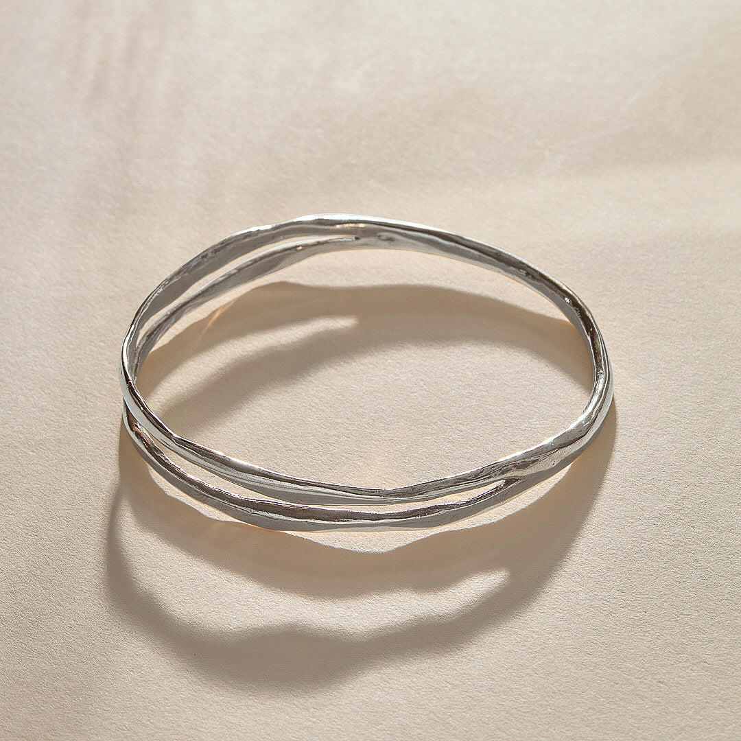 Reverie Organic Bangle Bracelet in recycled sterling silver, a hand-carved bangle that splits down the center like a canyon.