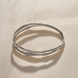 Reverie Organic Bangle Bracelet in recycled sterling silver, a hand-carved bangle that splits down the center like a canyon.