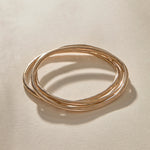 Set of 3 Rustic Bangles in bronze from above, the three organic bands overlapping.