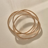 Set of 3 Rustic Bangles in recycled bronze stacked together.