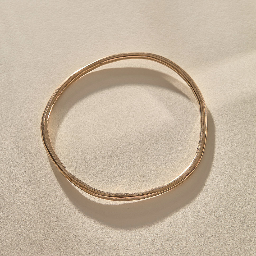 Rustic Bangle Bracelet in recycled bronze, a single organic hand-polished bangle.
